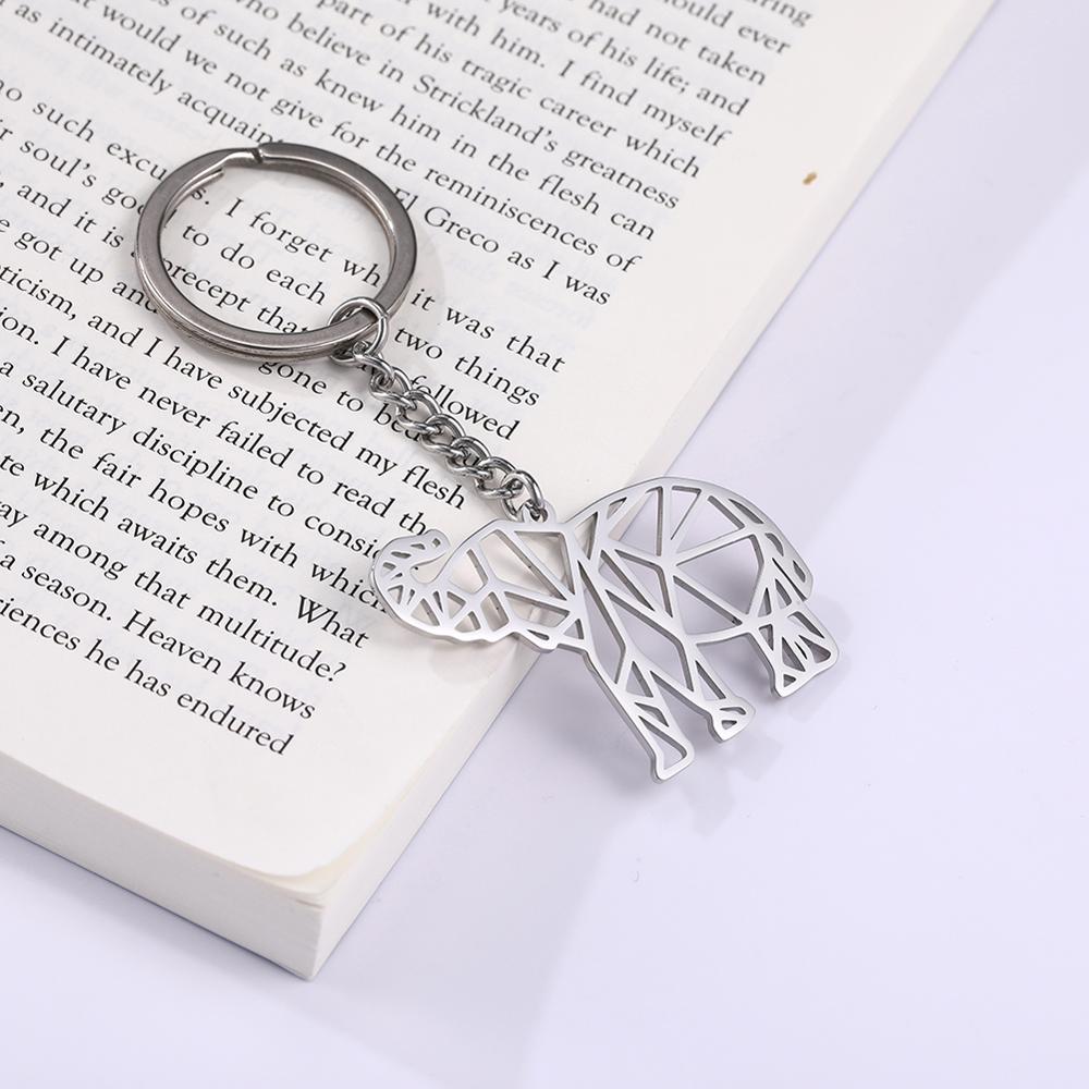 Porte clef elephant geometrique sur un livre