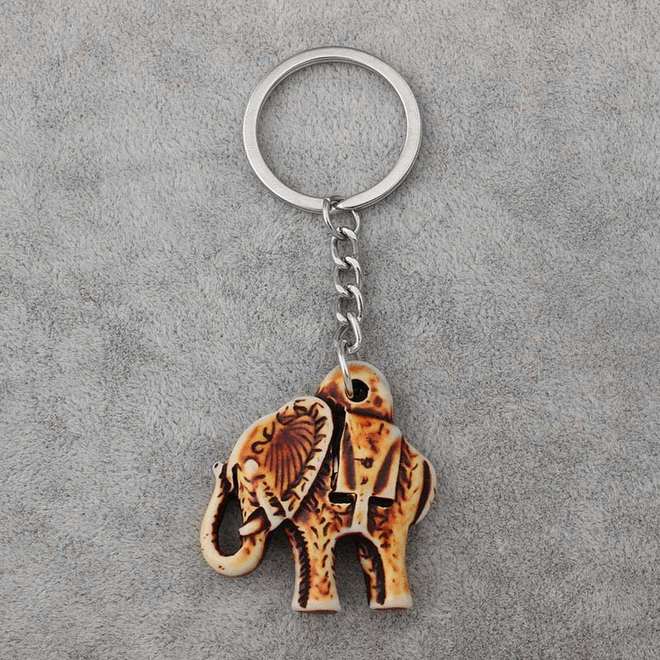 Porte-clef elephant tribal couleur beige antique