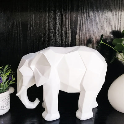 Statue elephant blanc posee sur un meuble noir