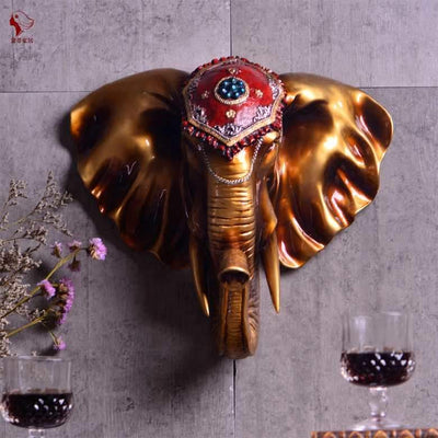 Version dorée de la tête d'éléphant murale